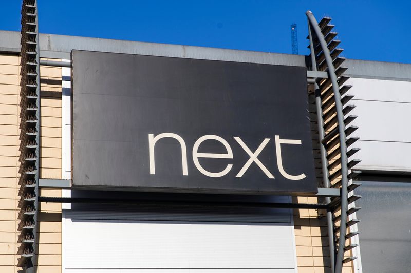 A logo of clothing retailer Next is seen at a