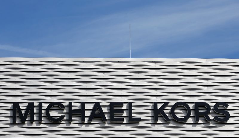 The logo of Michael Kors is seen on an outlet