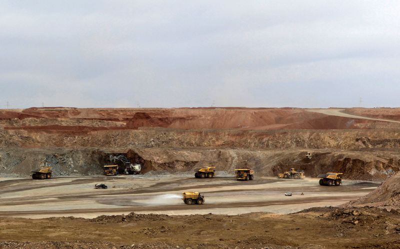 FILE PHOTO: Mining trucks are seen at the Oyu Tolgoi
