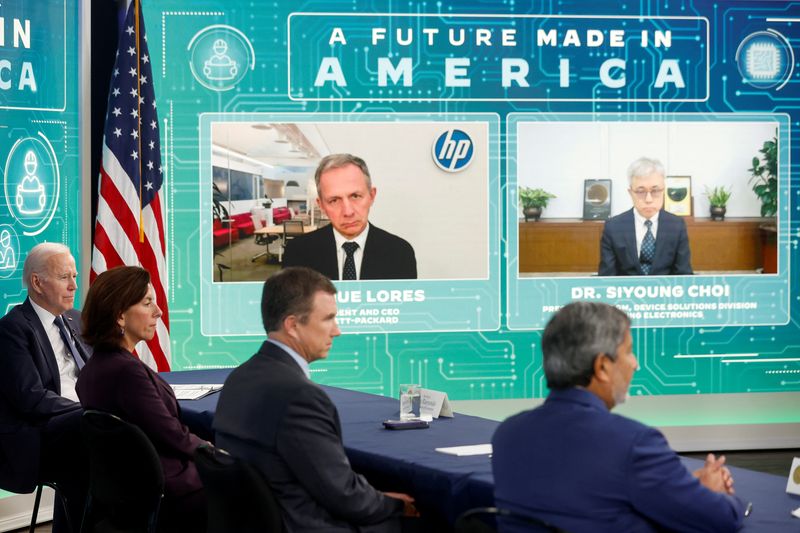 U.S. President Biden and Commerce Secretary Raimondo hold a virtual