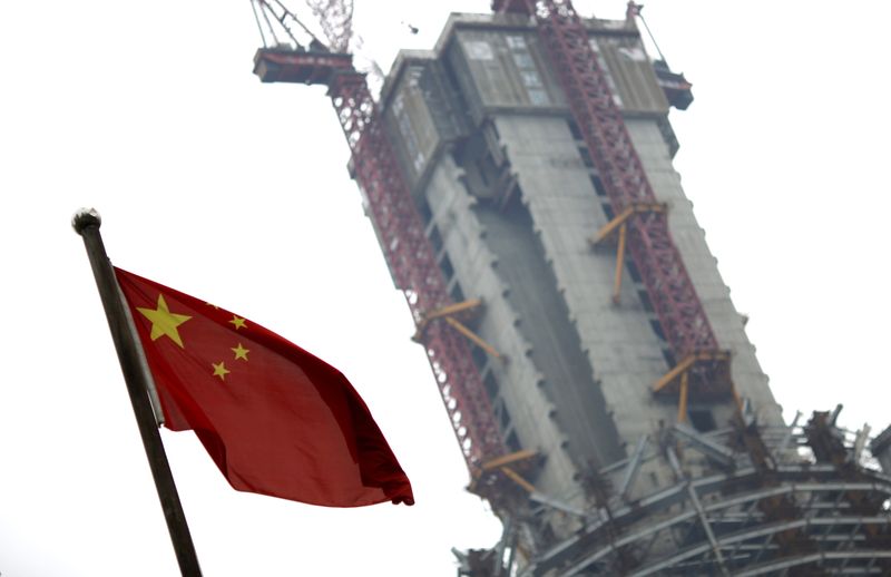 A Chinese national flag is seen near a construction site
