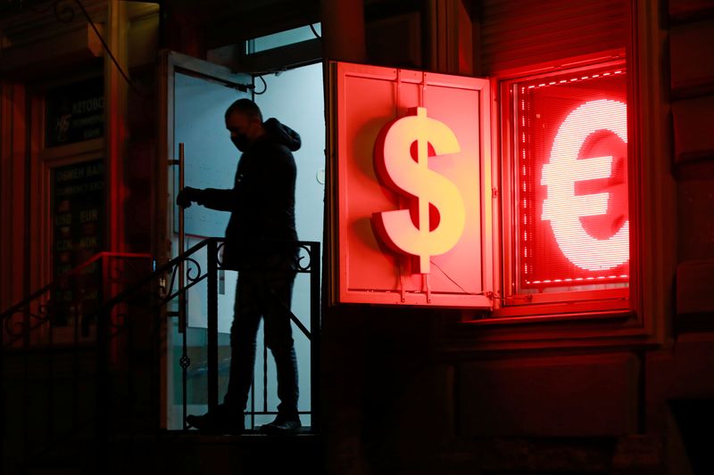 A man walks out of a currency exchange office in