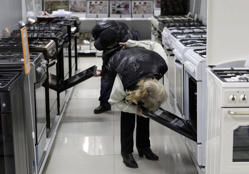 Customers inspect kitchen stoves at an electronic store in Stavropol