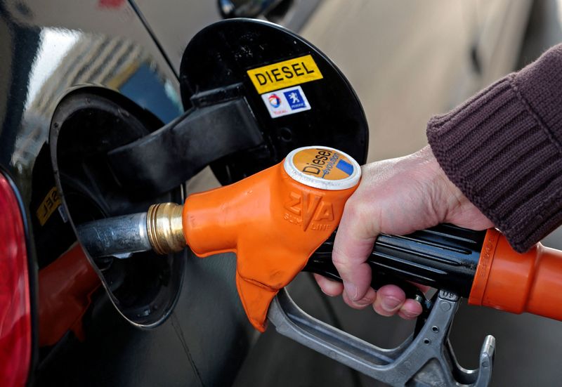 FILE PHOTO: A customer fills-up his car with diesel at