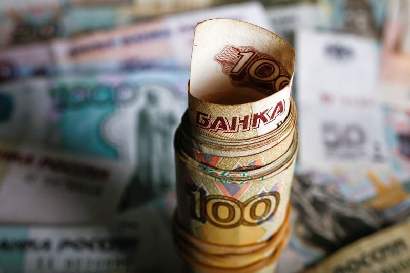 FILE PHOTO: A picture illustration shows rolled Russian rouble banknotes
