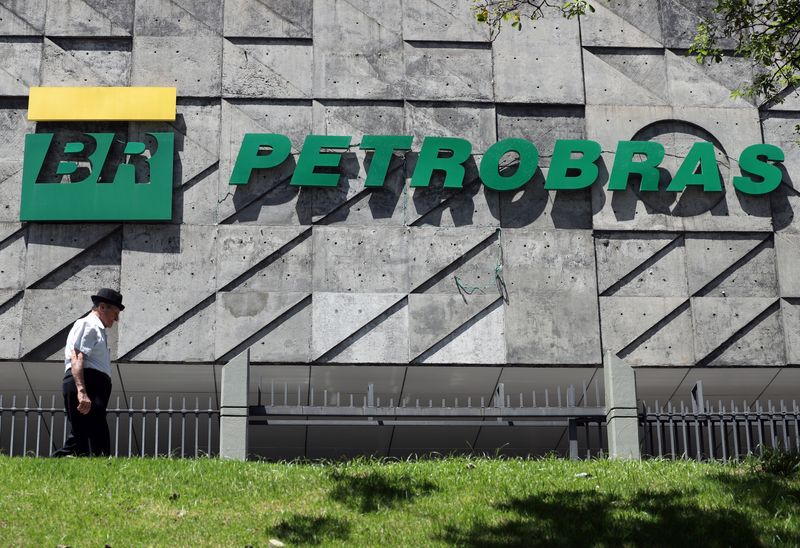 A man walks in front of the headquarters of Petroleo
