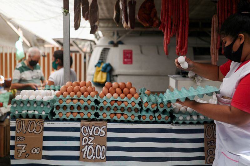 FILE PHOTO: Shopping at a weekly street market in Rio