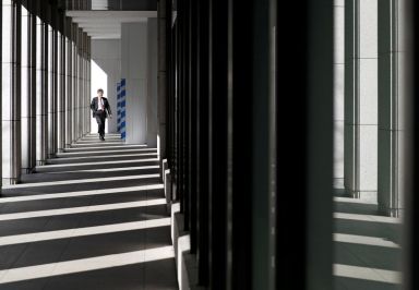 Businessman walks at an office building in Tokyo