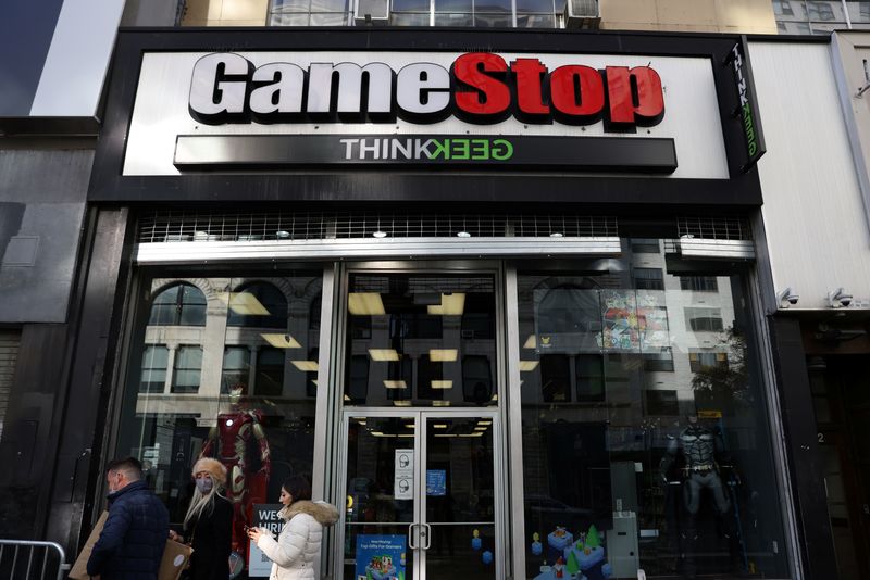People walk by a GameStop in Manhattan, New York