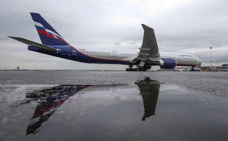 FILE PHOTO: An Aeroflot Boeing 777-300ER aircraft is reflected in
