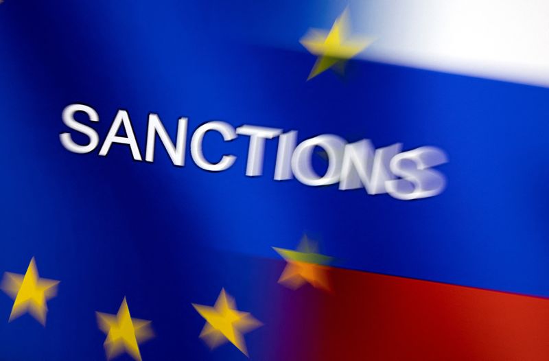 Illustration shows word “Sanctions” displayed on EU and Russian flags
