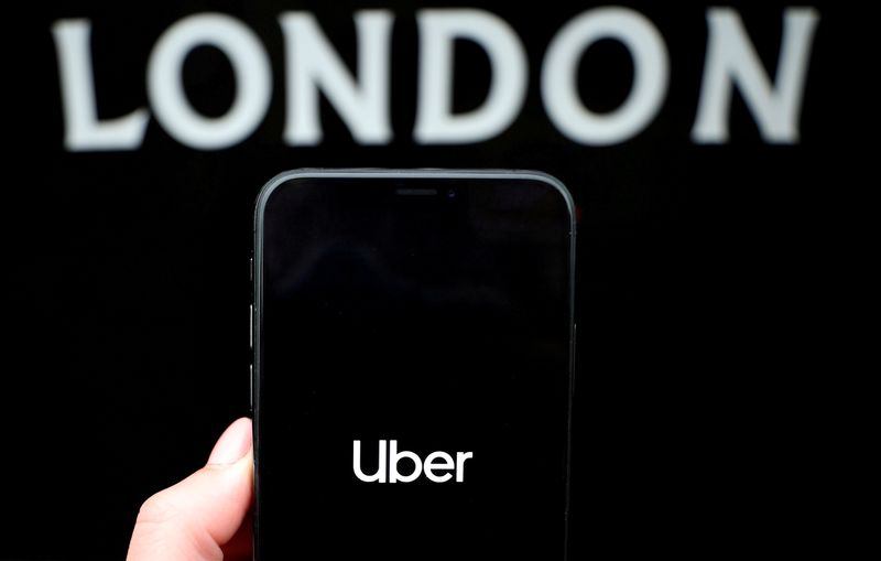 FILE PHOTO: The Uber logo is displayed on a mobile