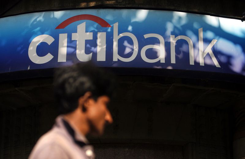 A man walks in front of a Citibank branch in