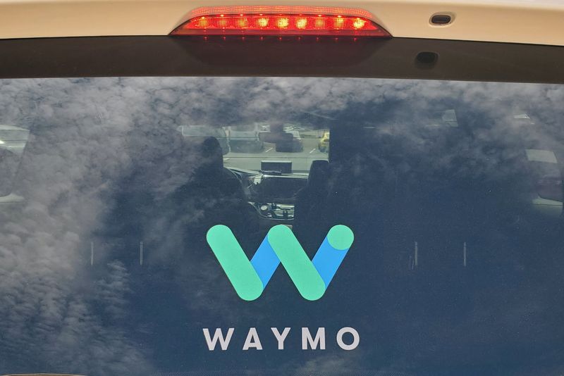 Rear window of a Waymo Chrysler Pacifica robotaxi is seen