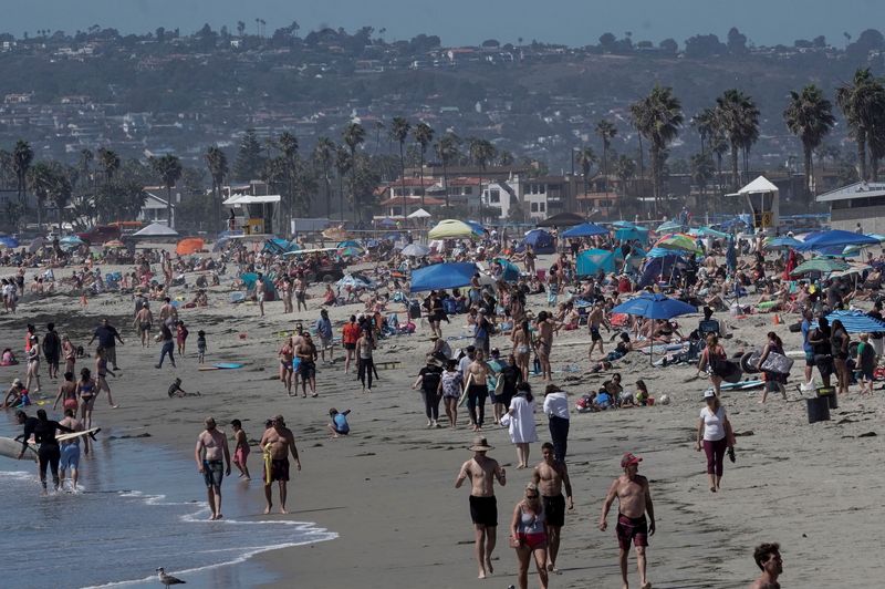 FILE PHOTO: People crowd San Diego beaches on July Fourth