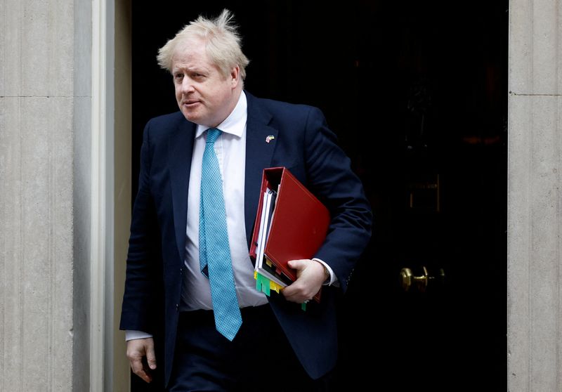 FILE PHOTO: British PM Boris Johnson leaves Downing Street in