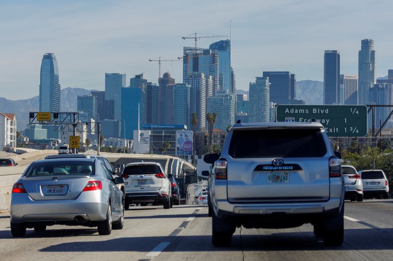 Traffic moves along a freeway as vehicles travel towards Los