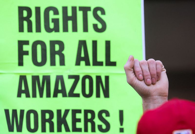 Amazon.com Inc workers react to the outcome of the vote