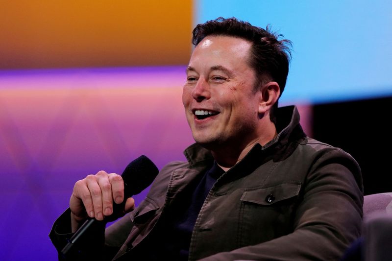 FILE PHOTO: Tesla CEO Elon Musk speaks during a conversation