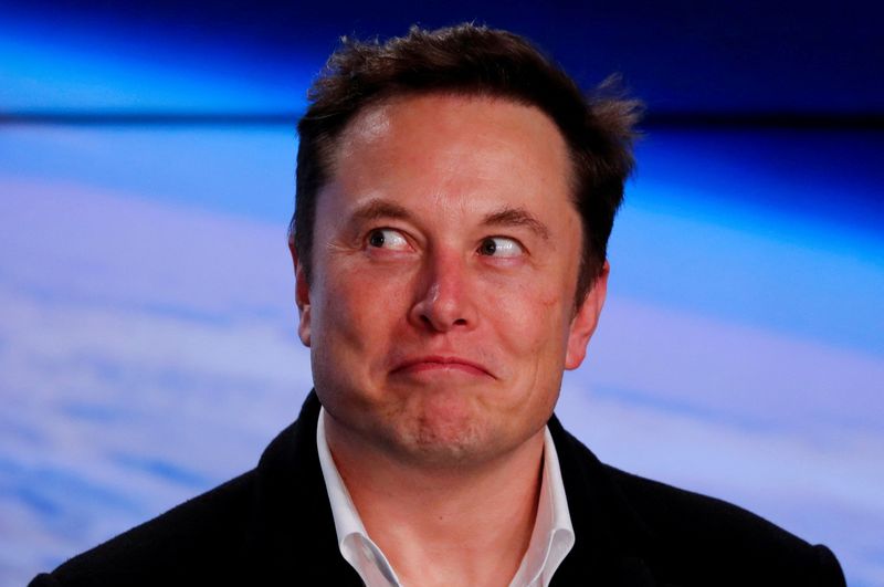 FILE PHOTO: SpaceX founder Musk reacts at a post-launch news