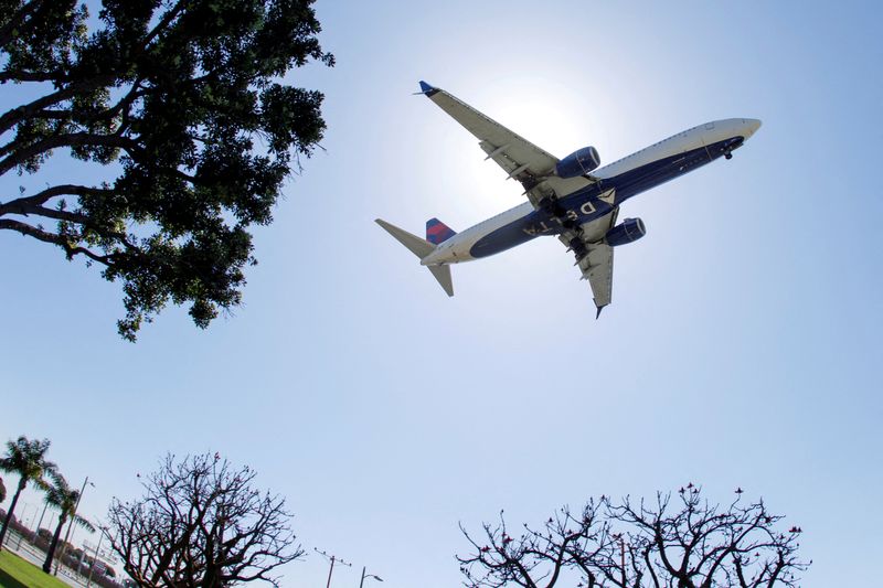 FILE PHOTO: A Delta Airlines passenger jet approaches to land