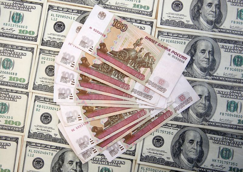 FILE PHOTO: A picture illustration shows U.S. Dollar and Russian