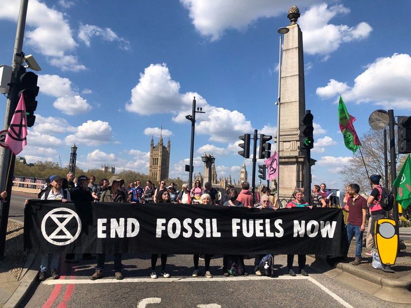 Activists from the Extinction Rebellion block bridges during the Just