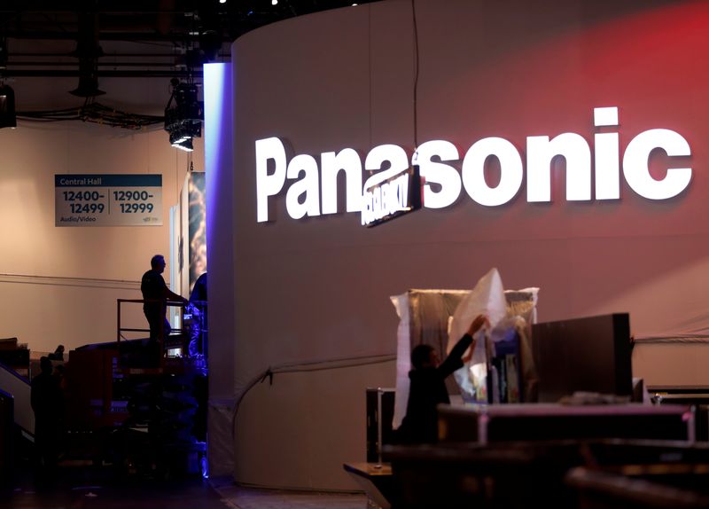 FILE PHOTO: Workers set up a Panasonic booth at the