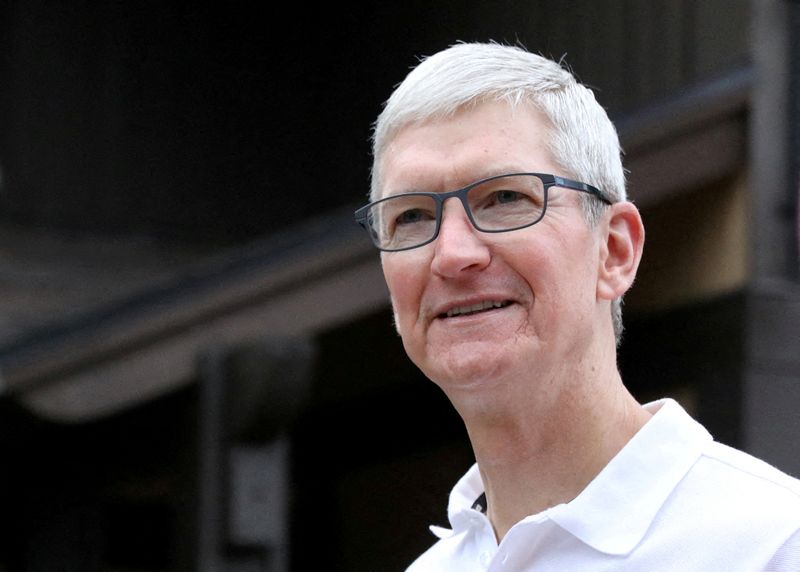 FILE PHOTO: Tim Cook, CEO of Apple, attends the annual