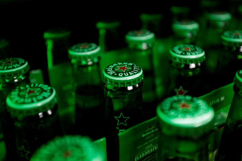 FILE PHOTO: Heineken beer bottles are seen at a bar