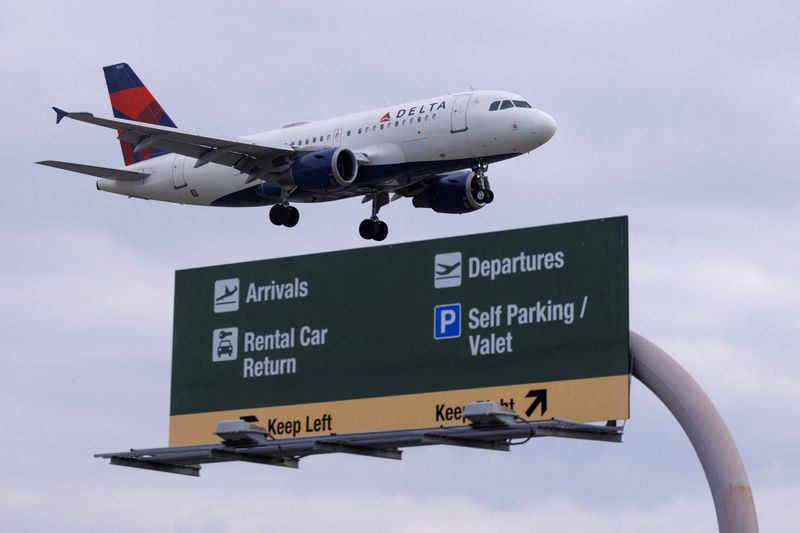 A Delta Airlines commercial aircraft approaches to land at John