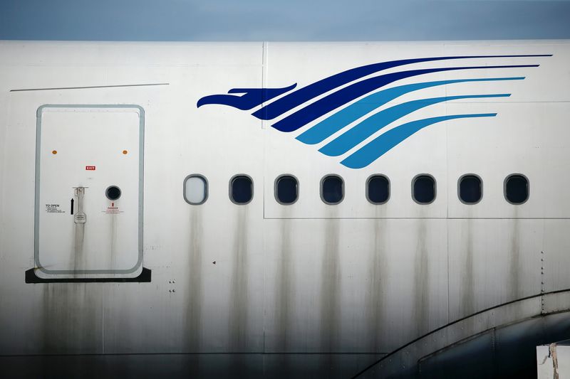 The Garuda Indonesia’s sign is seen on its aeroplane parked