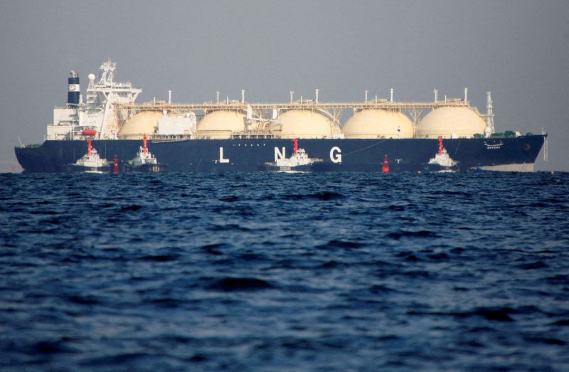 FILE PHOTO: An LNG tanker is tugged towards a thermal
