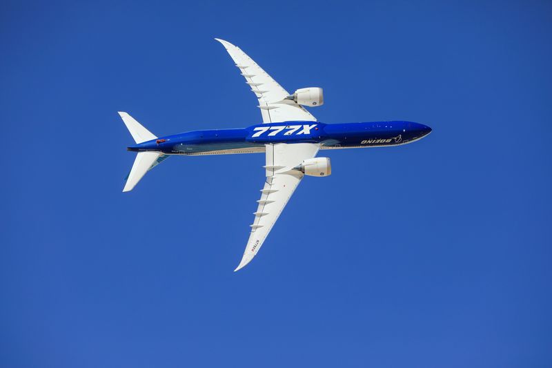 A Plane Boeing 777X performs during the Dubai Airshow, in