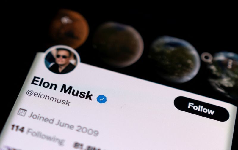 A photo illustration shows Elon Musk’s twitter account