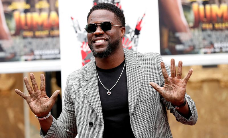 FILE PHOTO: Actor Hart shows his hands after placing them