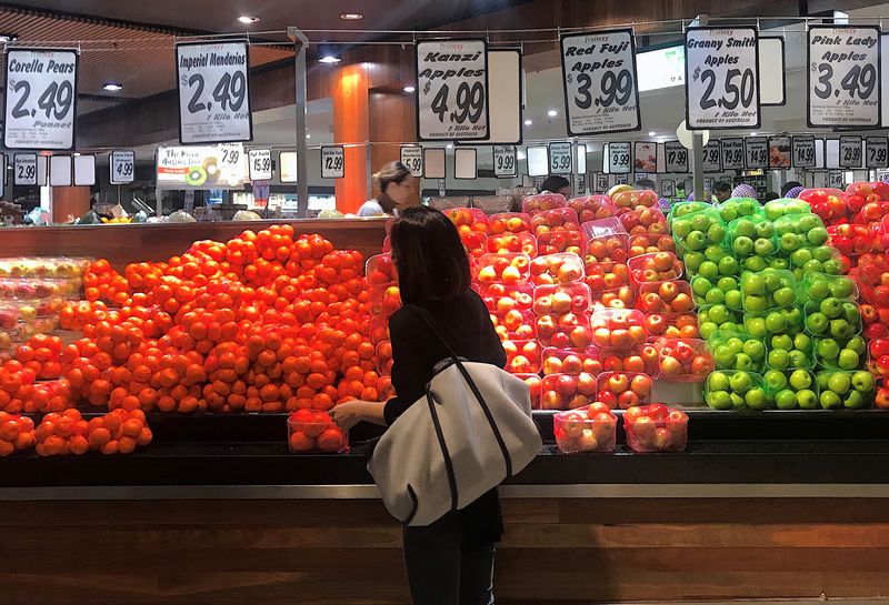 FILE PHOTO: A shopper looks at a range of fruit