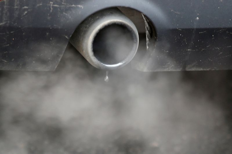 FILE PHOTO: An exhaust emits fumes as a car is