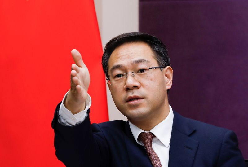 FILE PHOTO: Chinese Commerce Ministry spokesman Gao Feng gestures during