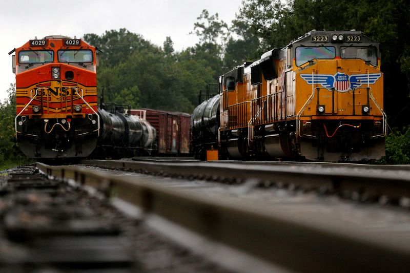 FILE PHOTO: BNSF and Union Pacific train engines stand still
