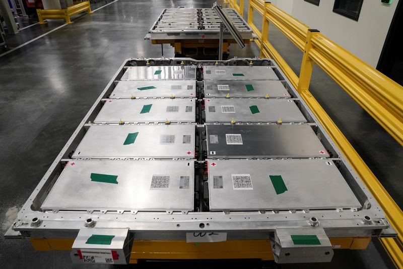 The electric vehicle battery tray assembly line is seen at
