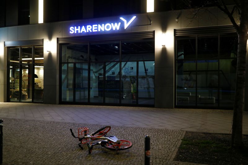 Sharing bike lies in front of an office of the