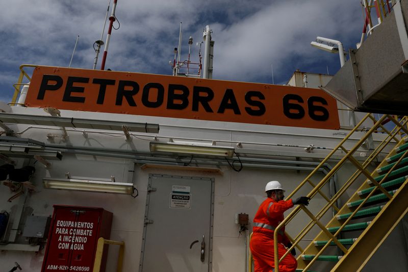 FILE PHOTO: A worker walks inside the Brazil’s Petrobras P-66