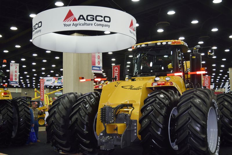 FILE PHOTO: People look at AGCO equipment as they attend