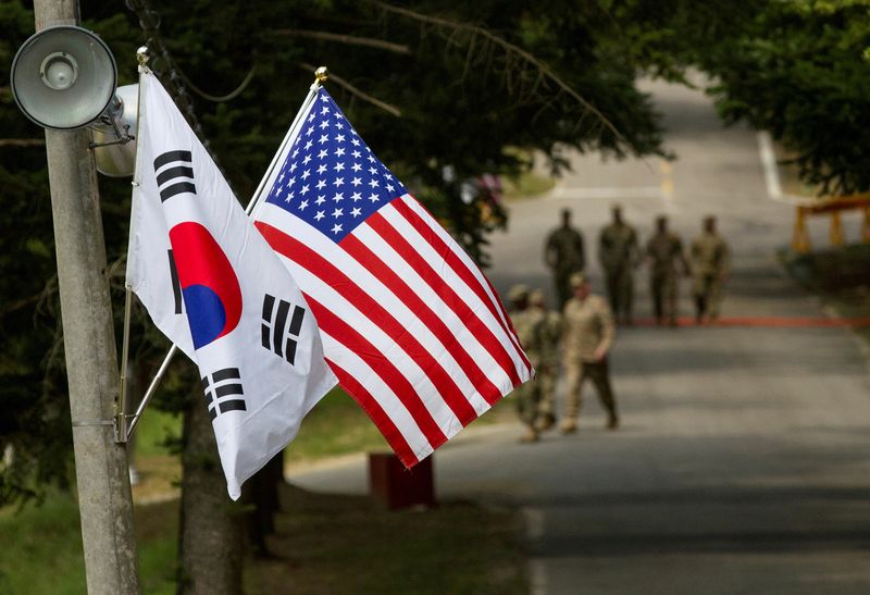 FILE PHOTO: American and South Korean flags at Yongin South