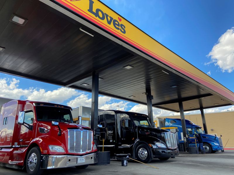 Trucks get refueled at a rest stop providing essential food