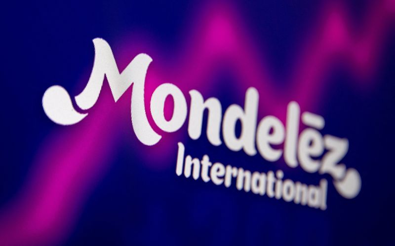 FILE PHOTO: Mondelez International logo and stock graph are seen