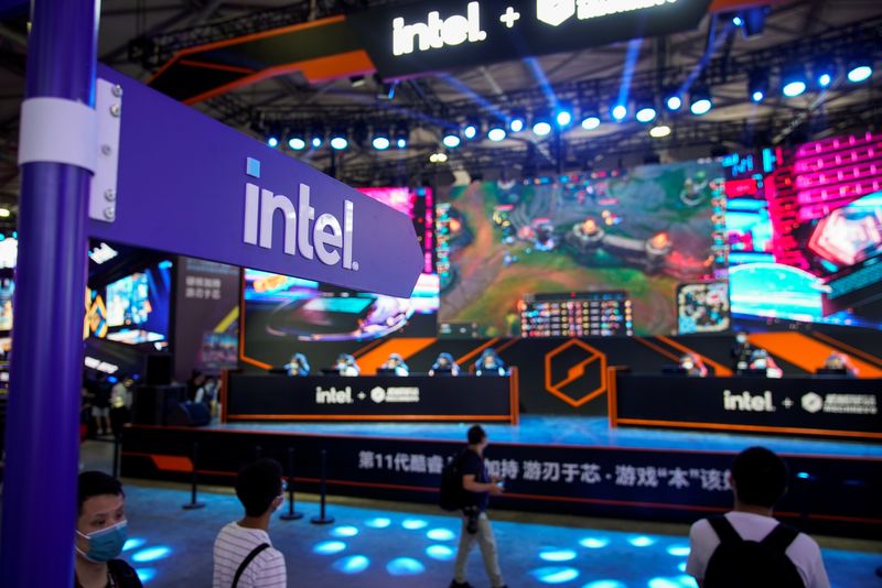 FILE PHOTO: Visitors are seen at the Intel booth during