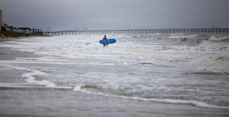A surfer navigates the wave in South Carolina