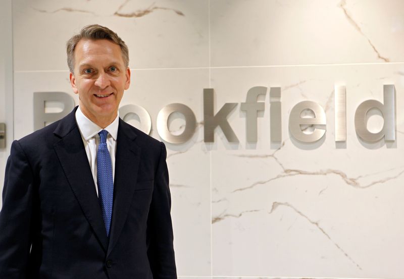 Bruce Flatt, CEO of Brookfield Asset Management, poses in front
